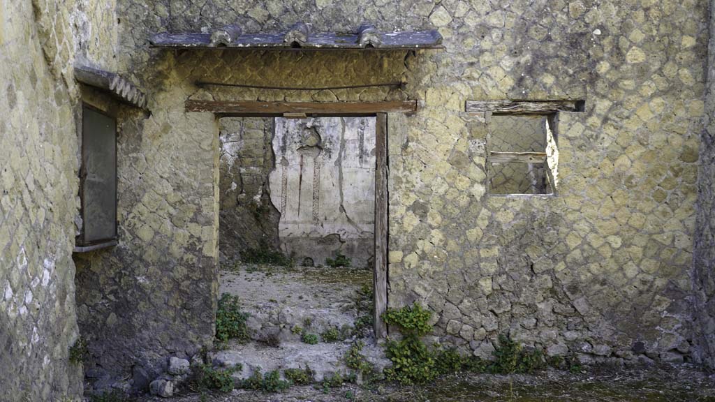 Ins. Orientalis II.16, Herculaneum. August 2021.
Looking towards east wall with doorway to a rear room. Photo courtesy of Robert Hanson.